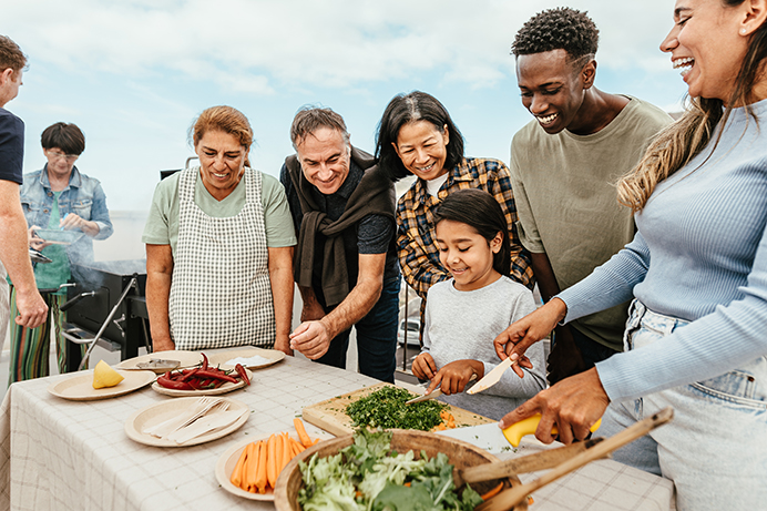 A diverse gathering of friends and family enjoying healthy activities.